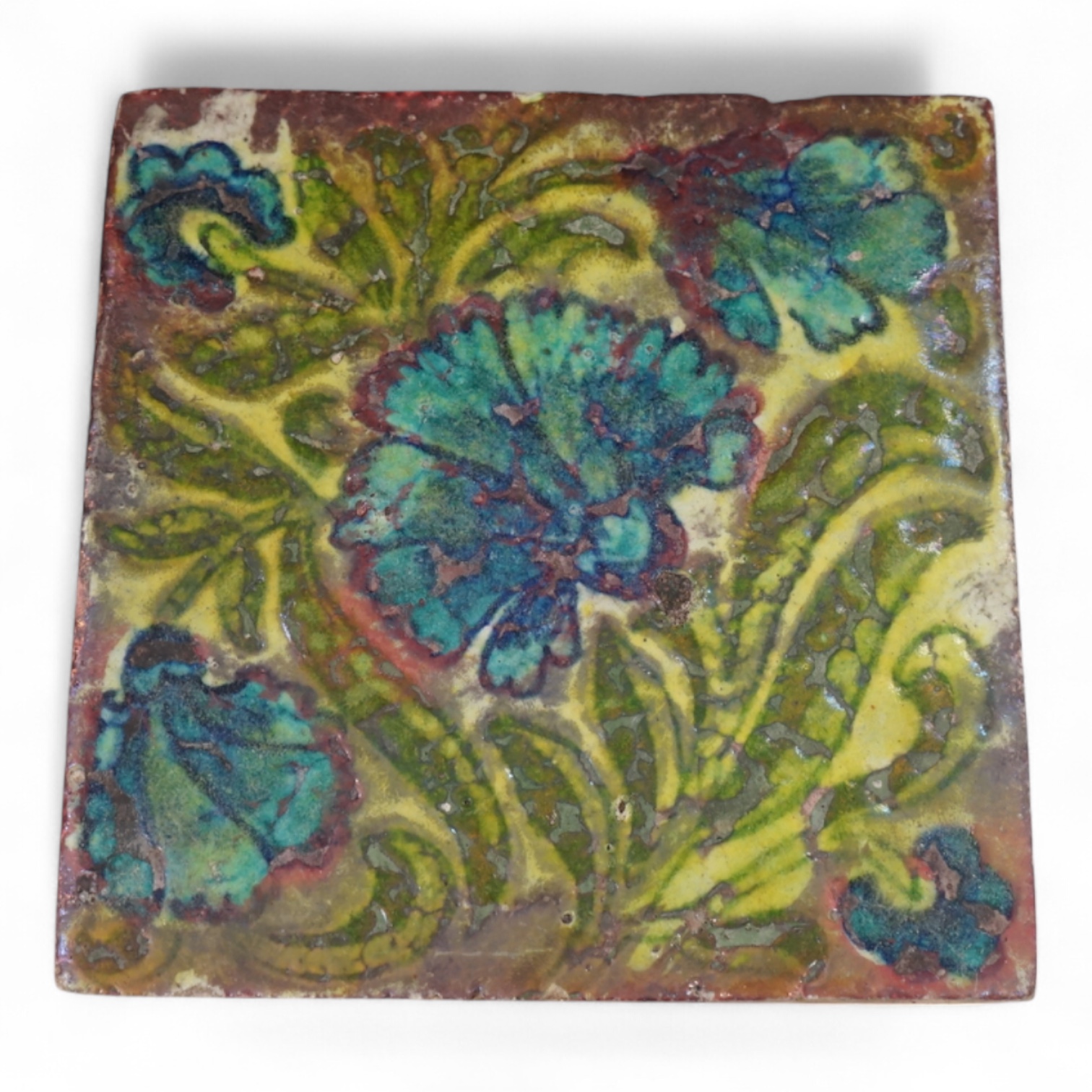 In the manner of William de Morgan, a Persian inspired experimental glazed tile, unmarked, 15cm wide